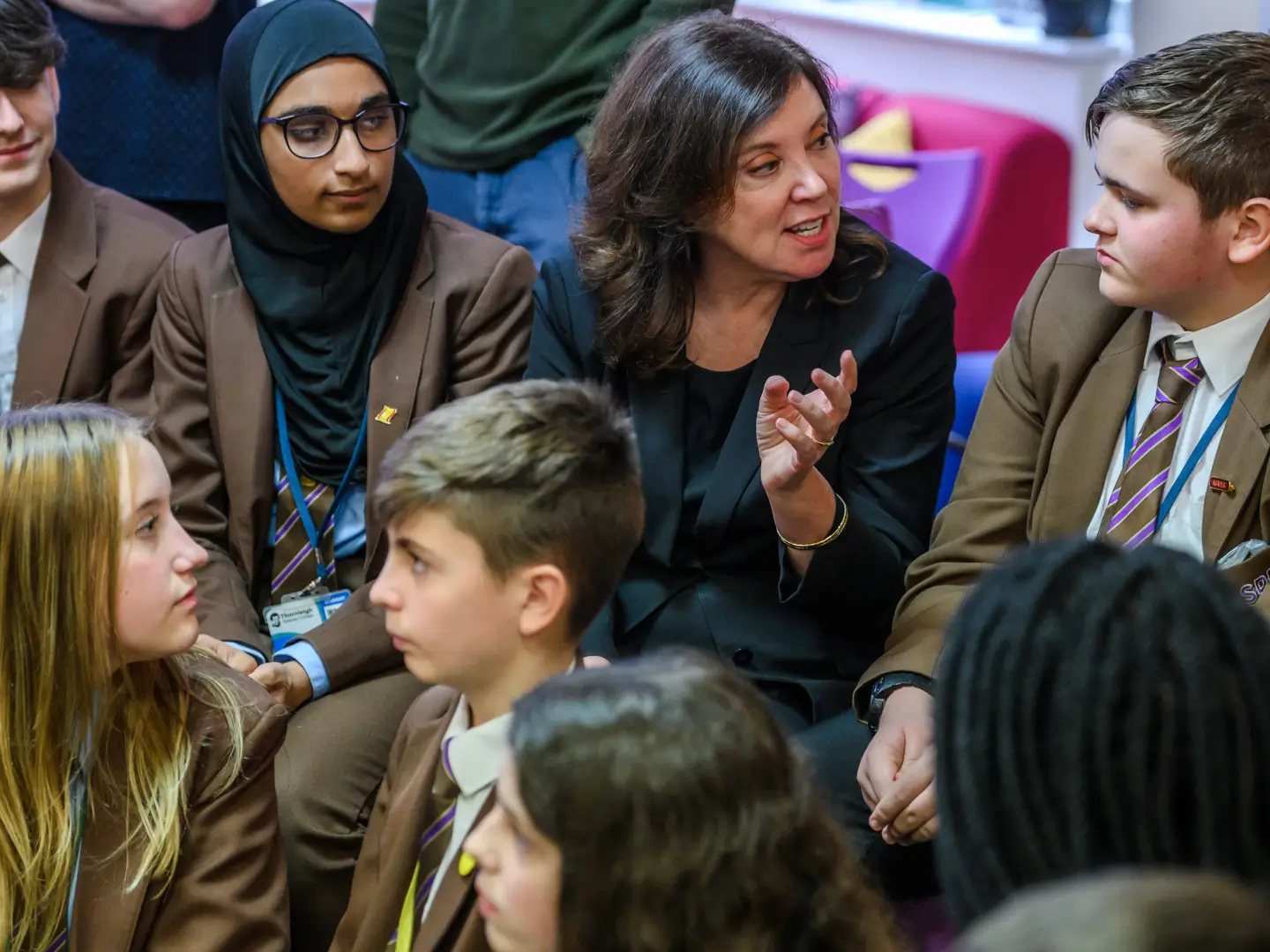 Dame Rachel de Souza talking to group of school children