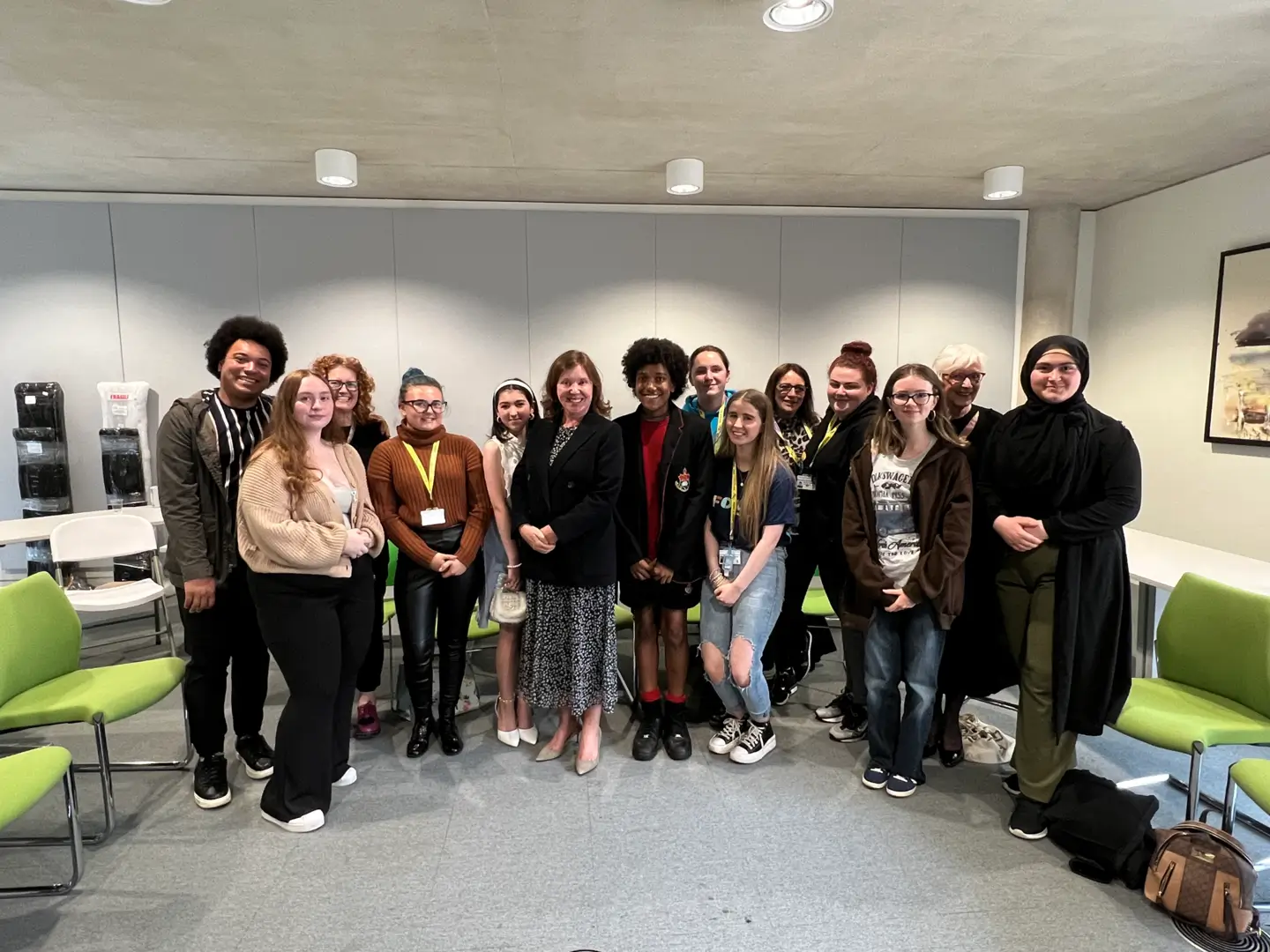 Dame Rachel de Souza with young people in a conference room